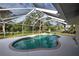 Inviting kidney-shaped pool with screened enclosure at 5280 Rolla Rd, Venice, FL 34293