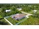 Aerial view of house with fenced backyard and neighborhood at 5552 Guest Ter, Port Charlotte, FL 33981