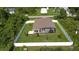 House with a fenced backyard, providing privacy and ample green space at 5552 Guest Ter, Port Charlotte, FL 33981