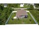 Aerial view of house with fenced backyard and neighborhood at 5552 Guest Ter, Port Charlotte, FL 33981