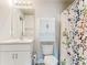 Clean bathroom with shower/tub combo, vanity, and linen storage at 5552 Guest Ter, Port Charlotte, FL 33981