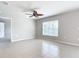 Spacious bedroom with tile floors and a ceiling fan at 5552 Guest Ter, Port Charlotte, FL 33981