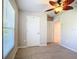 Bright bedroom with ceiling fan, window with blinds and closet at 5552 Guest Ter, Port Charlotte, FL 33981
