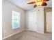 Bedroom with ceiling fan, window with blinds and closet at 5552 Guest Ter, Port Charlotte, FL 33981