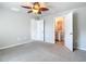 Bedroom with ceiling fan and access to bathroom at 5552 Guest Ter, Port Charlotte, FL 33981