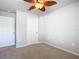 Bedroom with ceiling fan and double door closet at 5552 Guest Ter, Port Charlotte, FL 33981