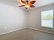 Bedroom with ceiling fan and window with blinds at 5552 Guest Ter, Port Charlotte, FL 33981