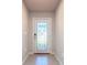 Bright entryway with a modern glass door and neutral tile flooring at 5552 Guest Ter, Port Charlotte, FL 33981