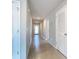 A hallway with light walls and tile floors at 5552 Guest Ter, Port Charlotte, FL 33981