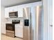 Modern kitchen with stainless steel appliances and white cabinets at 5552 Guest Ter, Port Charlotte, FL 33981