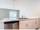 Modern kitchen with white cabinets and stainless steel appliances at 5552 Guest Ter, Port Charlotte, FL 33981