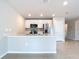 Open kitchen with island and stainless steel appliances at 5552 Guest Ter, Port Charlotte, FL 33981