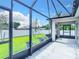 Spacious screened patio with backyard view and lush green grass at 5552 Guest Ter, Port Charlotte, FL 33981