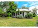 Spacious backyard with lush landscaping and patio at 560 Fallbrook Dr, Venice, FL 34292