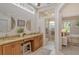 Well-appointed bathroom with dual vanities, granite countertops, and a separate shower at 560 Fallbrook Dr, Venice, FL 34292