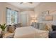 Comfortable bedroom with a queen bed and home office area at 560 Fallbrook Dr, Venice, FL 34292