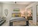 Comfortable bedroom with a stylish bed frame and mirrored closet doors at 560 Fallbrook Dr, Venice, FL 34292