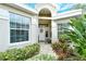 Inviting front entrance with a white door and decorative wreath at 560 Fallbrook Dr, Venice, FL 34292