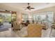 Comfortable living room with sliding glass doors to patio at 560 Fallbrook Dr, Venice, FL 34292