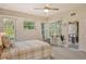 Comfortable main bedroom with ensuite bathroom access and backyard views at 560 Fallbrook Dr, Venice, FL 34292