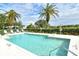 Community pool with plenty of lounge chairs at 560 Fallbrook Dr, Venice, FL 34292