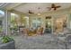 Relaxing screened patio with brick pavers and comfortable seating at 560 Fallbrook Dr, Venice, FL 34292