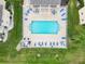 Community pool with plenty of lounge chairs at 5800 Sabal Trace Dr # 501, North Port, FL 34287