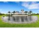 Talon Preserve community entrance with pond and landscaping at 6260 Talon Preserve Dr, Nokomis, FL 34275