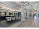 Elegant hallway with hardwood floors and modern light fixtures at 6260 Talon Preserve Dr, Nokomis, FL 34275