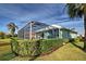 Private backyard oasis with a pool and screened enclosure at 660 Silk Oak Dr, Venice, FL 34293