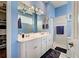Bright bathroom boasts double sinks, and a walk-in shower at 660 Silk Oak Dr, Venice, FL 34293