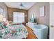 Bedroom with two twin beds and flamingo bedding at 660 Silk Oak Dr, Venice, FL 34293
