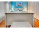 Bedroom with a sleigh bed, light blue walls, and wood floors at 660 Silk Oak Dr, Venice, FL 34293