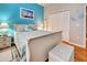 Bedroom with a white sleigh bed and blue walls at 660 Silk Oak Dr, Venice, FL 34293