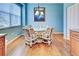 Breakfast nook with round table and wicker chairs at 660 Silk Oak Dr, Venice, FL 34293