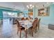 Bright dining room with table and view of pool at 660 Silk Oak Dr, Venice, FL 34293