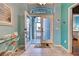 Bright entryway with double doors leading to a screened porch at 660 Silk Oak Dr, Venice, FL 34293