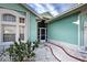 Landscaped front yard with a curved walkway leading to the entrance at 660 Silk Oak Dr, Venice, FL 34293