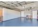 Spacious garage with ample storage cabinets and epoxy flooring at 660 Silk Oak Dr, Venice, FL 34293