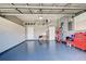 Garage with built-in storage and epoxy floor at 660 Silk Oak Dr, Venice, FL 34293