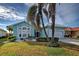 Single-story house with a two-car garage and landscaping at 660 Silk Oak Dr, Venice, FL 34293