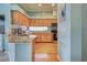 Kitchen with light wood cabinets and granite counters at 660 Silk Oak Dr, Venice, FL 34293