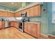 Kitchen with stainless steel appliances and light wood cabinets at 660 Silk Oak Dr, Venice, FL 34293