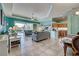Spacious living room with tiled floors and view of the pool at 660 Silk Oak Dr, Venice, FL 34293