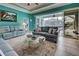 Living room with pool view and plenty of natural light at 660 Silk Oak Dr, Venice, FL 34293
