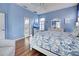 Main bedroom with a view of the bathroom and a comfortable armchair at 660 Silk Oak Dr, Venice, FL 34293