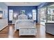 Main bedroom with pool view and white wooden furniture at 660 Silk Oak Dr, Venice, FL 34293