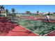 Two pickleball players enjoying a game on the court at 660 Silk Oak Dr, Venice, FL 34293