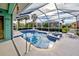 Relaxing pool area with spa and plenty of sunshine at 660 Silk Oak Dr, Venice, FL 34293