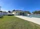 Community clubhouse with adjacent refreshing pool area at 660 Silk Oak Dr, Venice, FL 34293